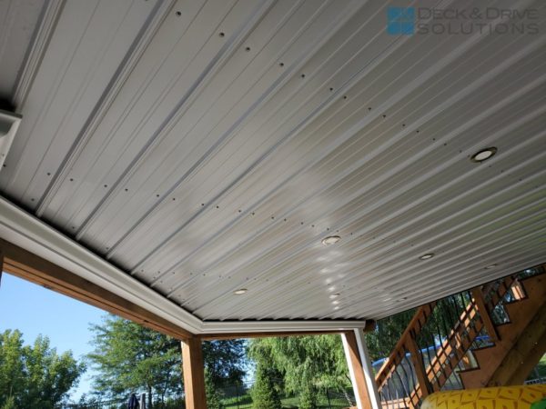 White Metal Roofing under a deck for ceiling with gutter