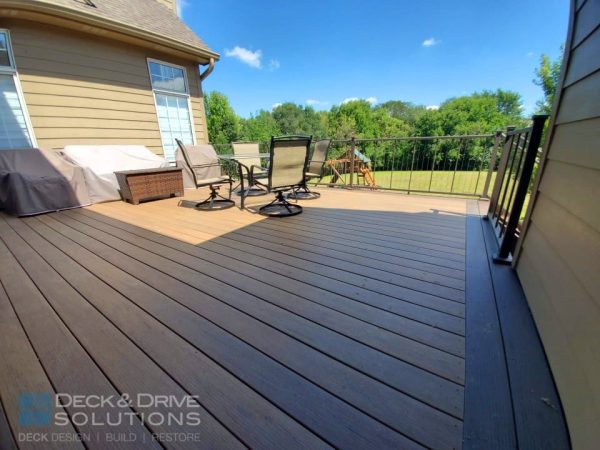 Timbertech Pecan decking with mocha accent board and westbury verticable railing in bronze