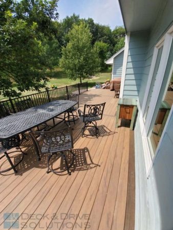 Composite Deck floor with Table and chairs on light blue house