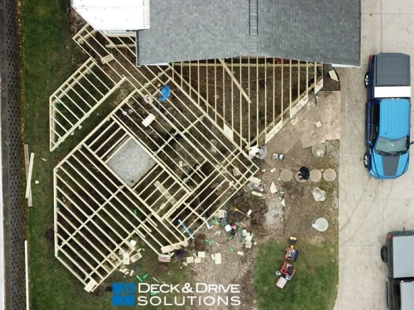 Joist layout for deck framing during the deck construction phase