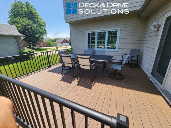 outdoor table and chairs on a new composite deck