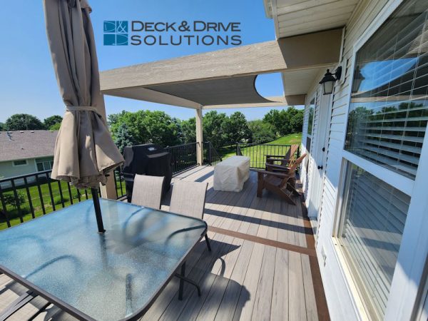 Timbertech Ashwood Decking with Mocha Picture Frame Board, Table and chairs with umbrella