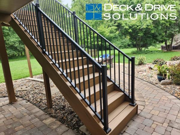 Timbertech Composite stairs on a landscaped brick patio