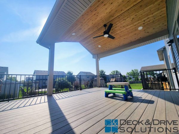 open gable covered deck with cedar ceiling above new composite ashwood timbertech deck