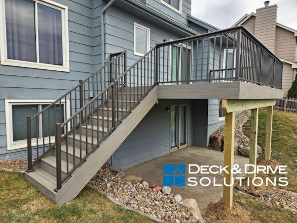 gray deck stairs with gripable handrail