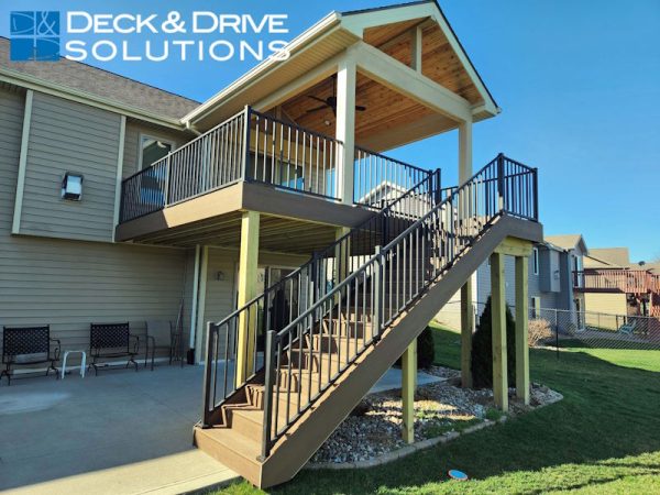 Covered Deck with Open Gable and Cedar ceiling. deck is Timbertech composite decking and metal railing