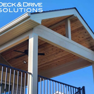 Open gable deck roof with cedar ceiling and decorative beams