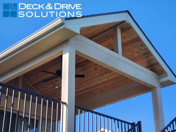 Open gable deck roof with cedar ceiling and decorative beams