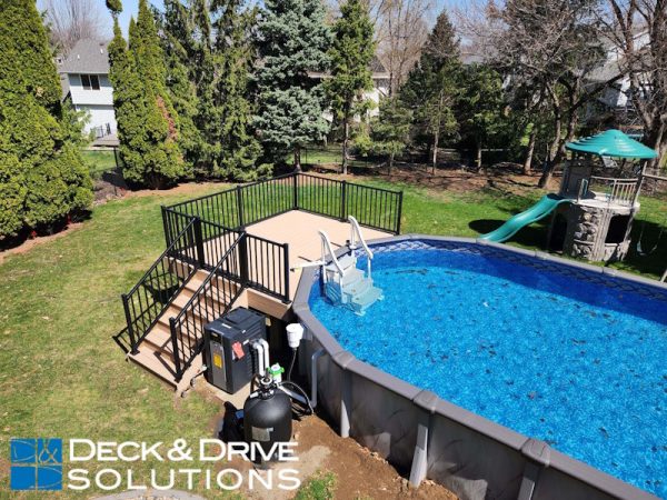 Simple Trex deck around an above ground pool, the railing has a gate for safety